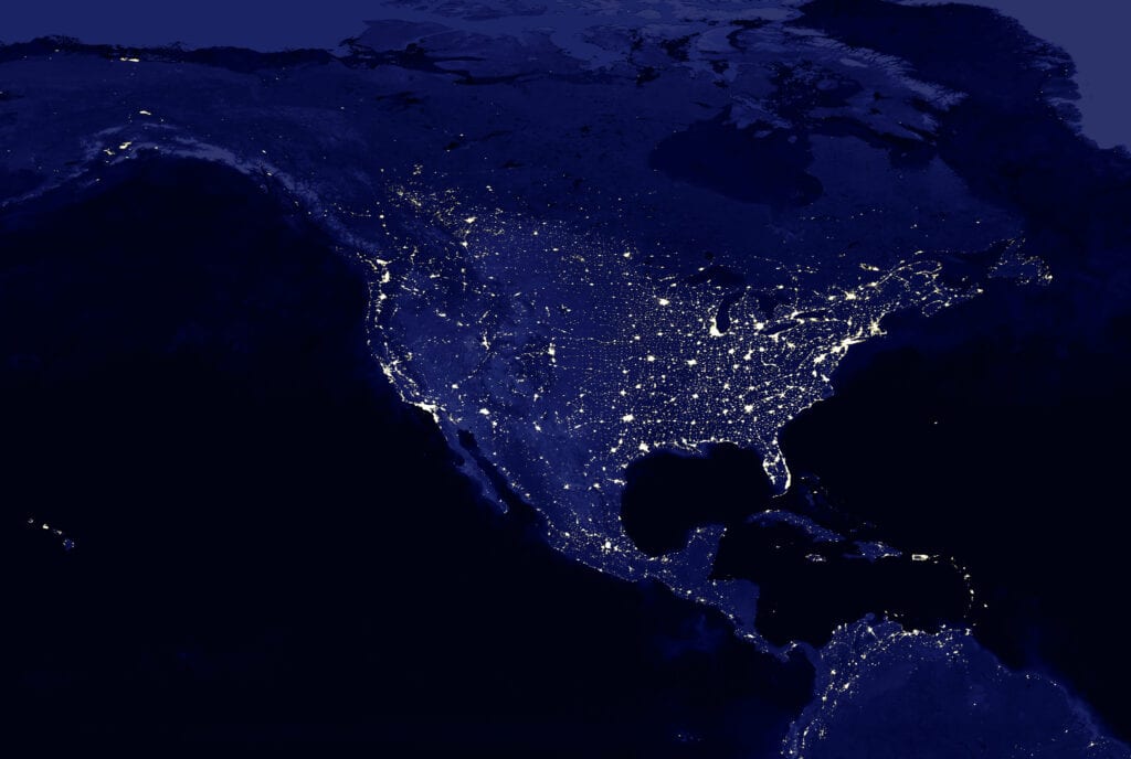 North American continent electric lights map at night. Electric  lighing of cities USA, Canada, Mexico at night. Map of North and Central America. View from outer space. Mixed media